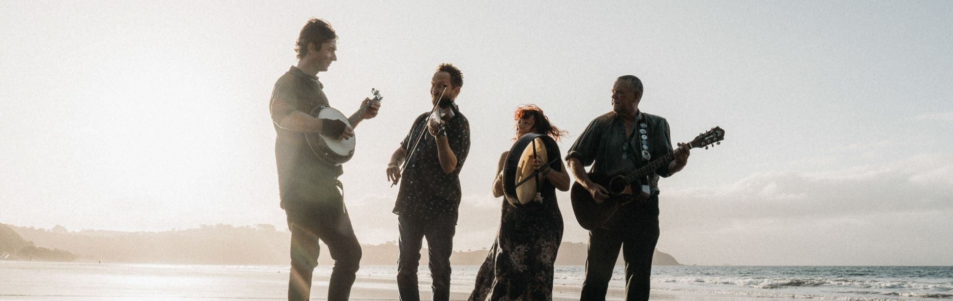 Gráinneog is Waiheke's finest folk band. The band is for hire for Waiheke weddings, and any other general entertainment around Waiheke and Auckland. Their first album, Laugh While You May, is available for sale on www.grainneog.net. In this photo they are having a fun session on the beach.